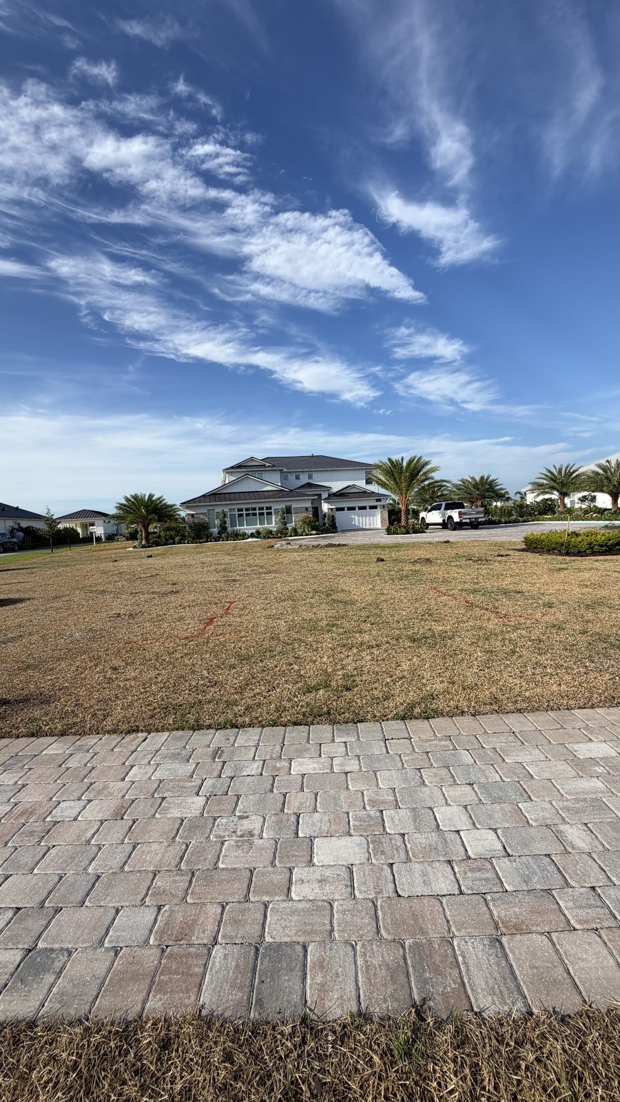 Front lawn dormant and patchy before fresh sod installation